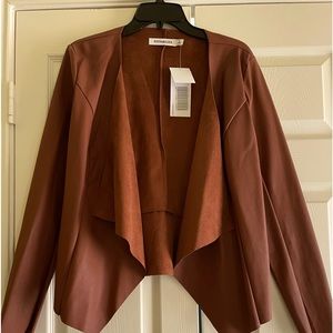 Faux leather jacket.  Not very warm but will dress up an outfit nicely.